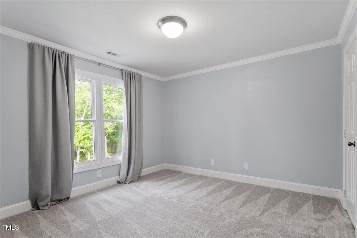 7209 Halstead Lane Raleigh, NC 27613 - Photo 43 of 64 an empty room with windows