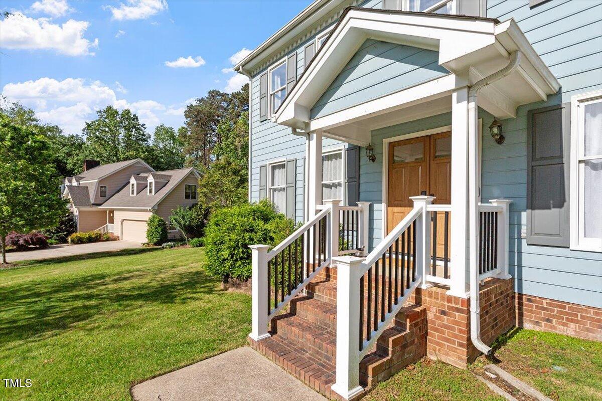 7209 Halstead Lane Raleigh, NC 27613 - Photo 5 of 64 a view of a house with a yard and sitting area