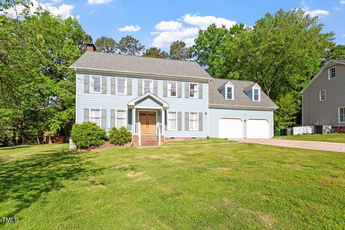 7209 Halstead Lane Raleigh, NC 27613 - Photo 62 of 64 a front view of a house with a yard