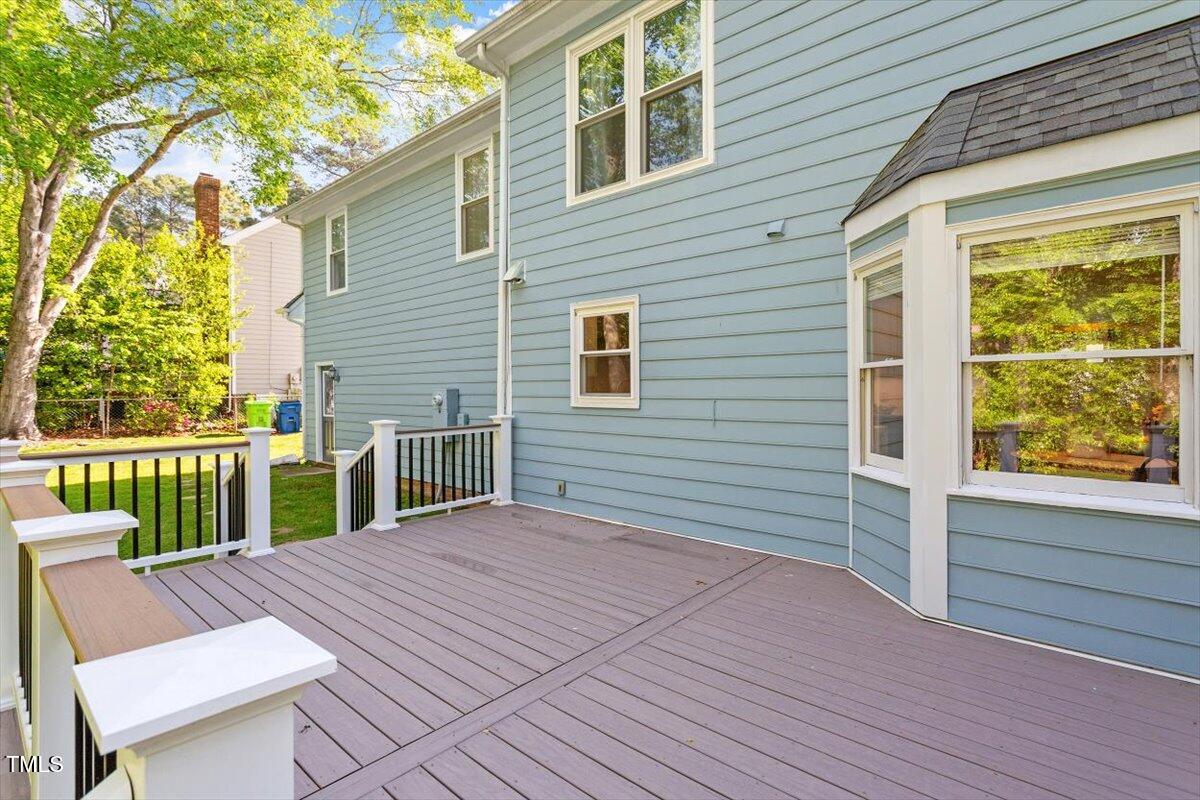 7209 Halstead Lane Raleigh, NC 27613 - Photo 9 of 64 a view of a deck with chair and wooden fence