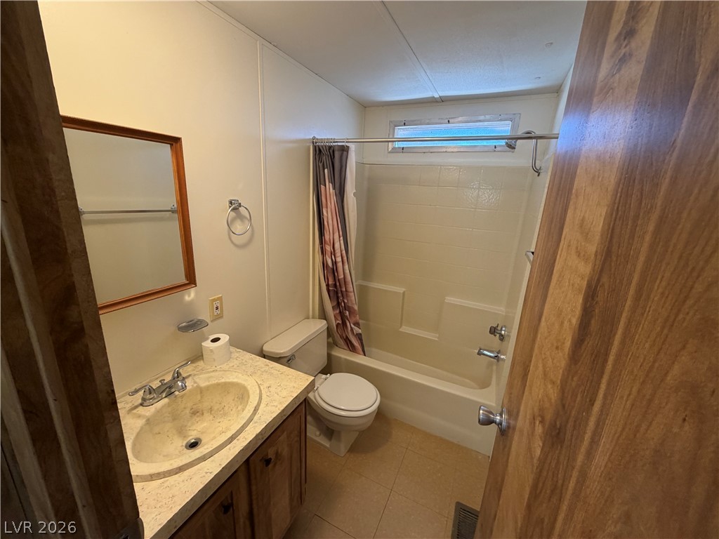 4360 Retread Road Pahrump, NV 89048 - Photo 8 of 19 A functional bathroom arrangement integrates a single vanity and a tub-shower unit efficiently.
