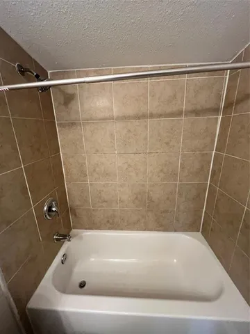 a bathroom with a bath tub