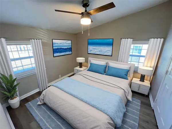 a bedroom with a large bed and a window