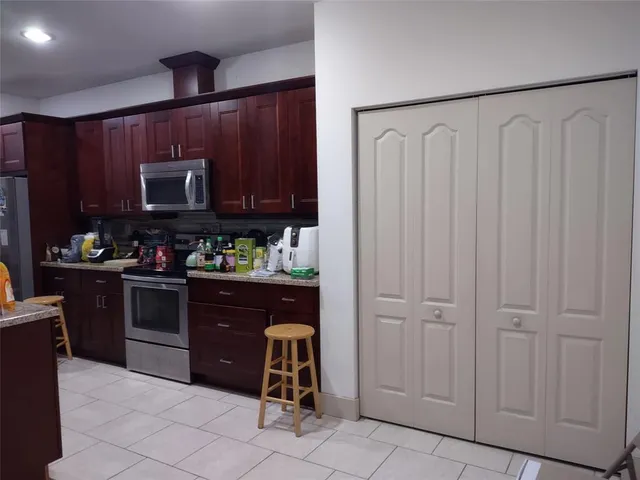 a bathroom with a toilet a sink and a mirror