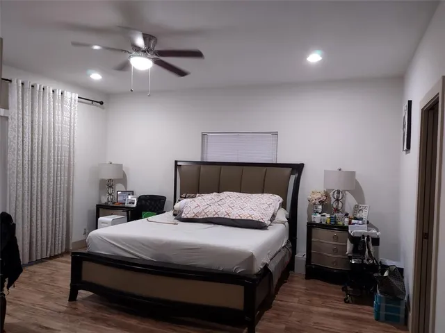 a bedroom with a bed and furniture
