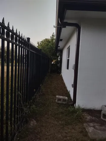 a backyard of a house with outdoor seating