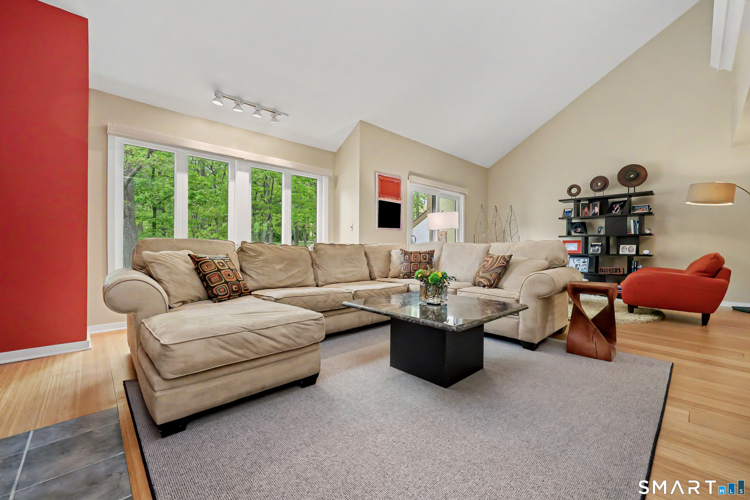 690 Forest Road, Unit 642 West Haven, CT 06516 - Photo 11 of 40 Living room has bold accent wall that highlights fireplace. Other photos virtually staged to show a more neutral option