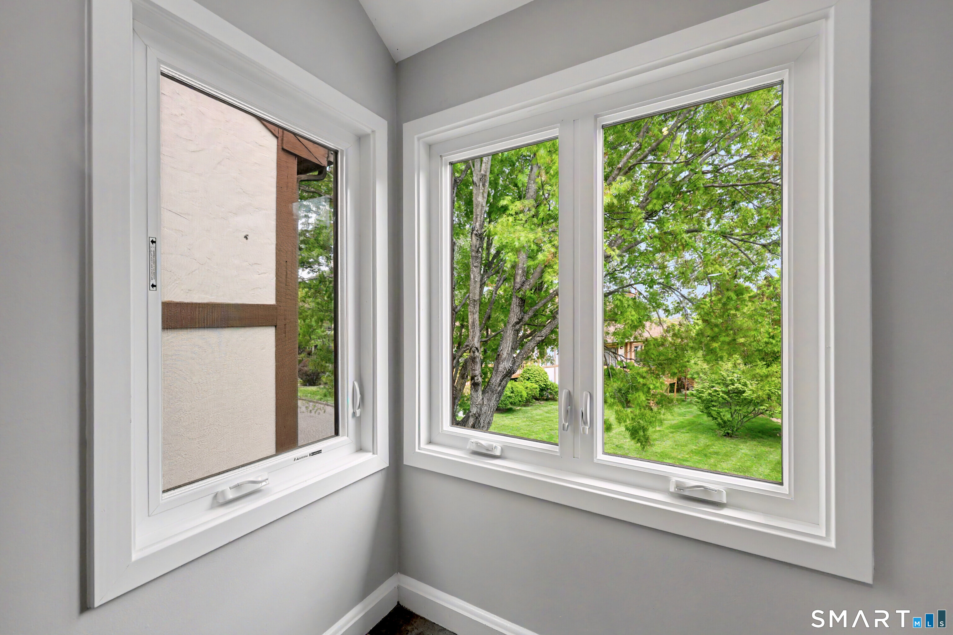 690 Forest Road, Unit 642 West Haven, CT 06516 - Photo 19 of 40 Heading upstairs, you can't help but notice the beautiful replacement windows and nature views from every window!