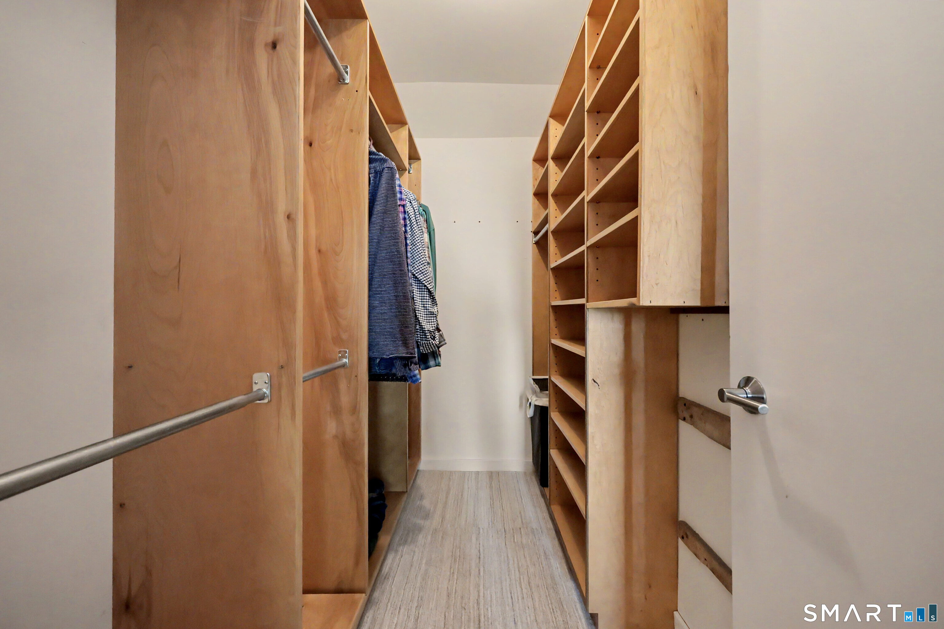 690 Forest Road, Unit 642 West Haven, CT 06516 - Photo 22 of 40 Wider than appears in the photo, the walk in closet has fabulously functional builtins. This photo captures the lovely carpet, too.