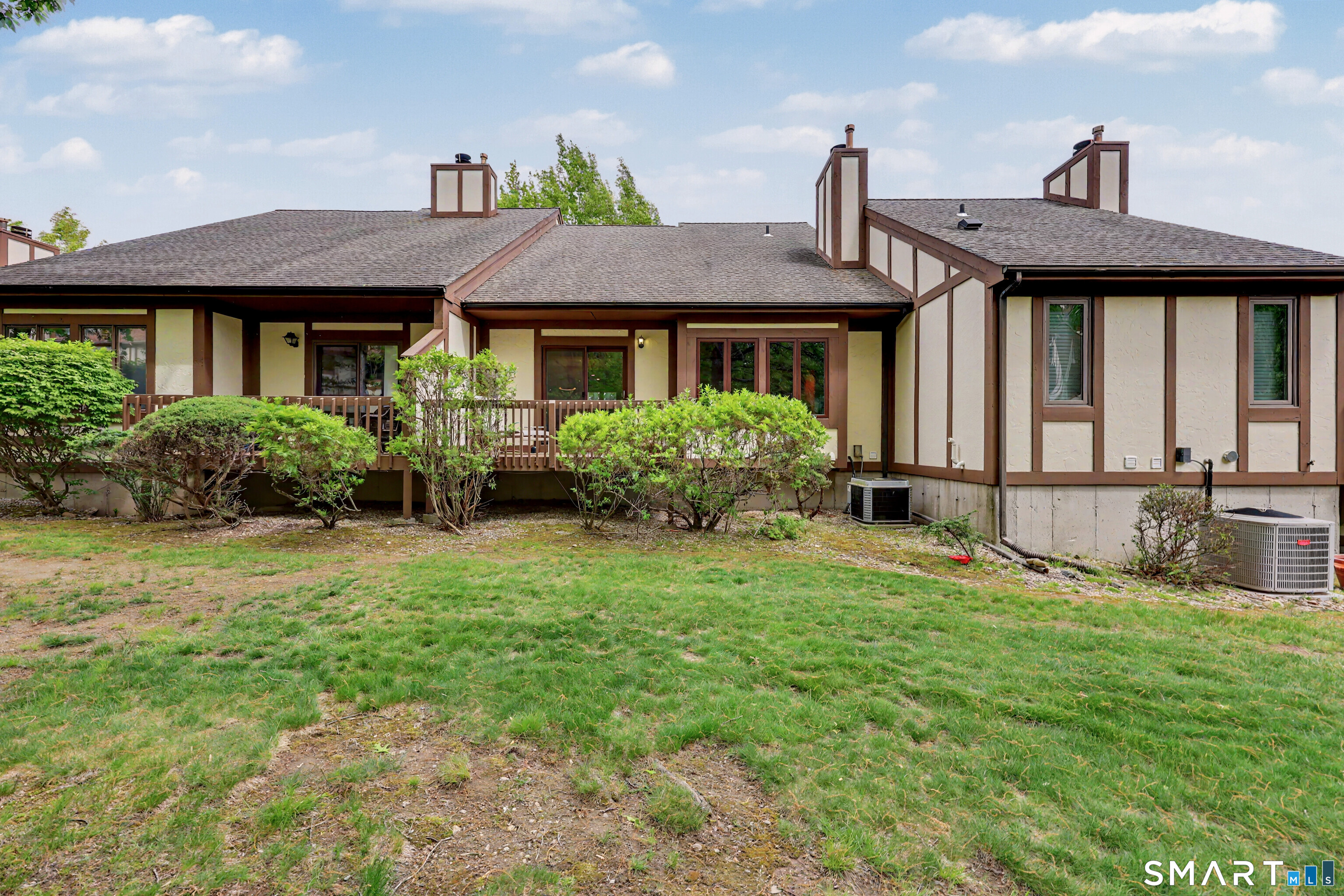 690 Forest Road, Unit 642 West Haven, CT 06516 - Photo 10 of 40 Deck is nicely tucked behind low profile shrubbery for a touch of natural verdant privacy