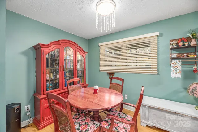 a view of a dining room with furniture and window