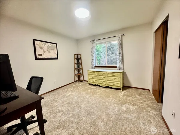 a view of a livingroom with furniture and a fireplace