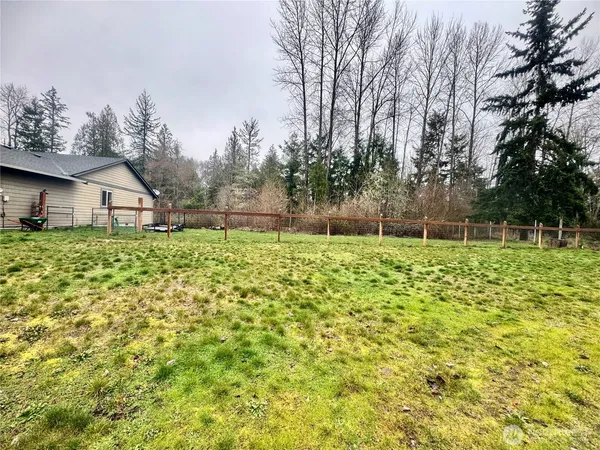 a backyard of a house with lots of green space