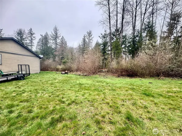a backyard of a house with lots of green space