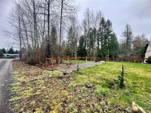 a backyard of a house with lots of green space