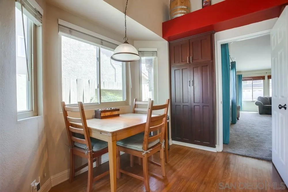 13036 Treecrest Street Poway, CA 92064 - Photo 11 of 37 a view of a dining room with furniture window and wooden floor