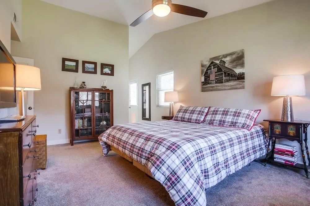 13036 Treecrest Street Poway, CA 92064 - Photo 14 of 37 a bedroom with a bed and a chandelier