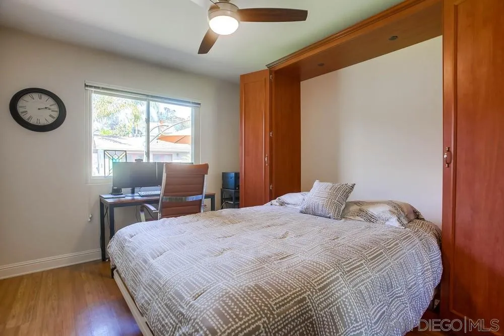 13036 Treecrest Street Poway, CA 92064 - Photo 19 of 37 a bedroom with a bed and a window