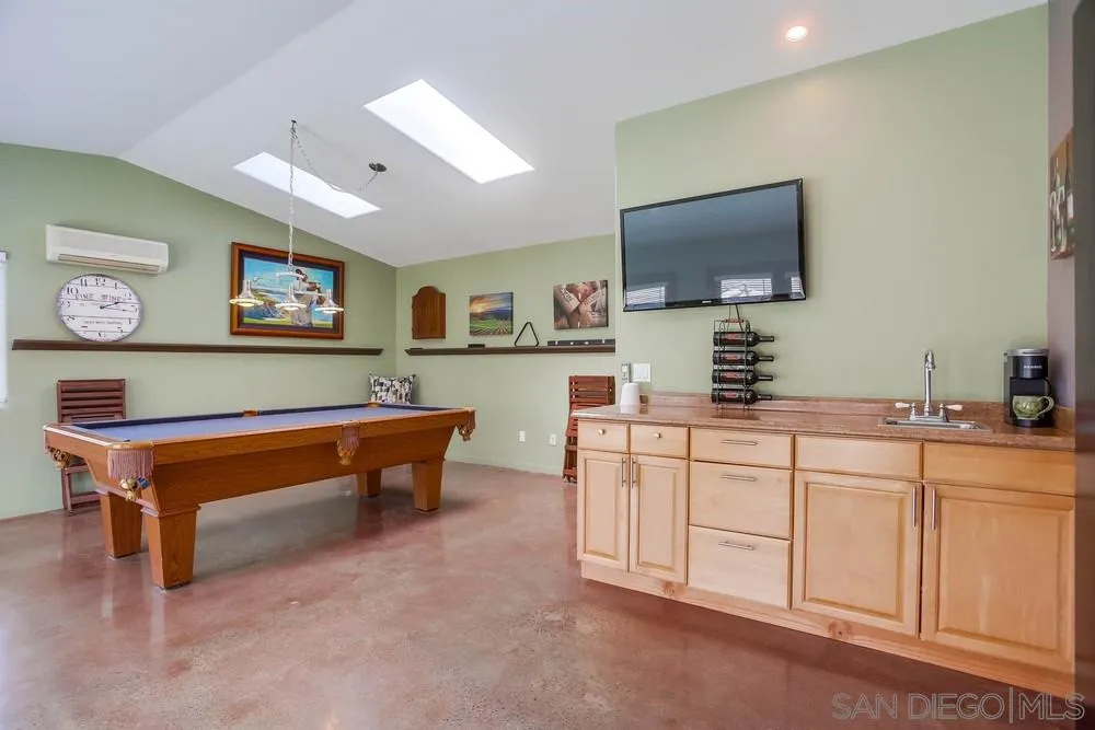 13036 Treecrest Street Poway, CA 92064 - Photo 24 of 37 a living room with furniture and a flat screen tv