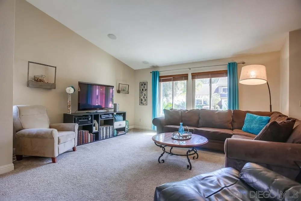13036 Treecrest Street Poway, CA 92064 - Photo 3 of 37 a living room with furniture and a flat screen tv