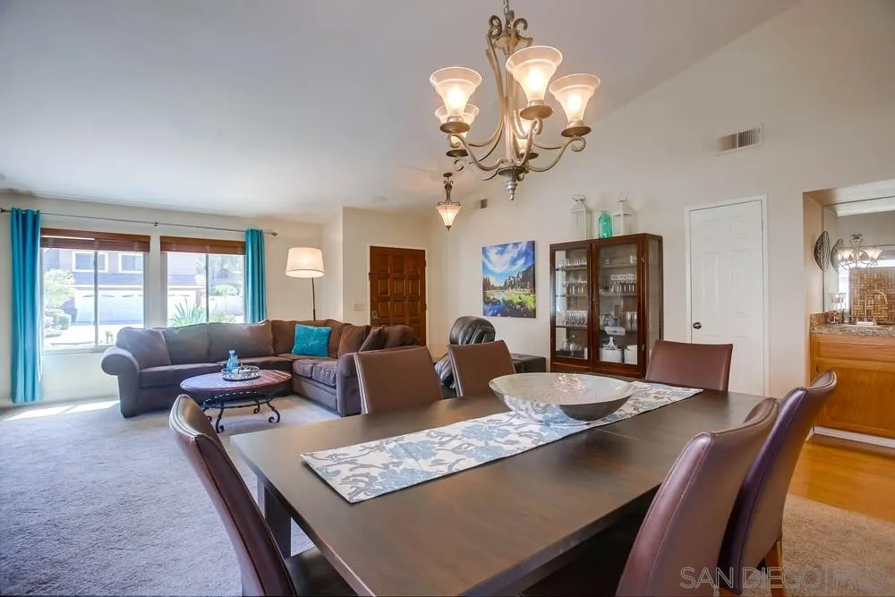 13036 Treecrest Street Poway, CA 92064 - Photo 5 of 37 a living room with fireplace furniture and a chandelier