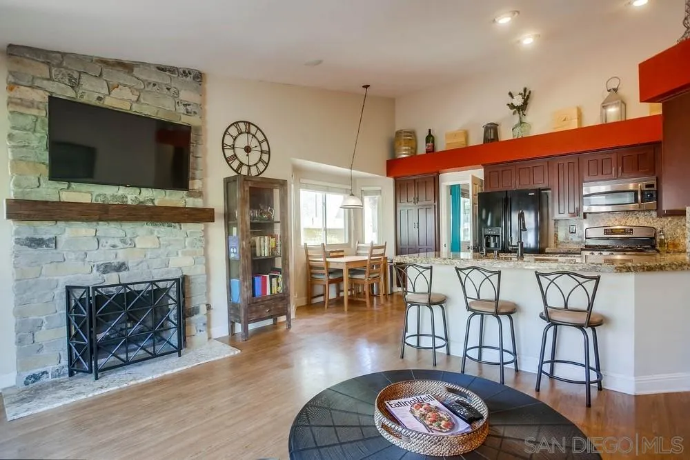 13036 Treecrest Street Poway, CA 92064 - Photo 8 of 37 a living room with fireplace furniture and a flat screen tv