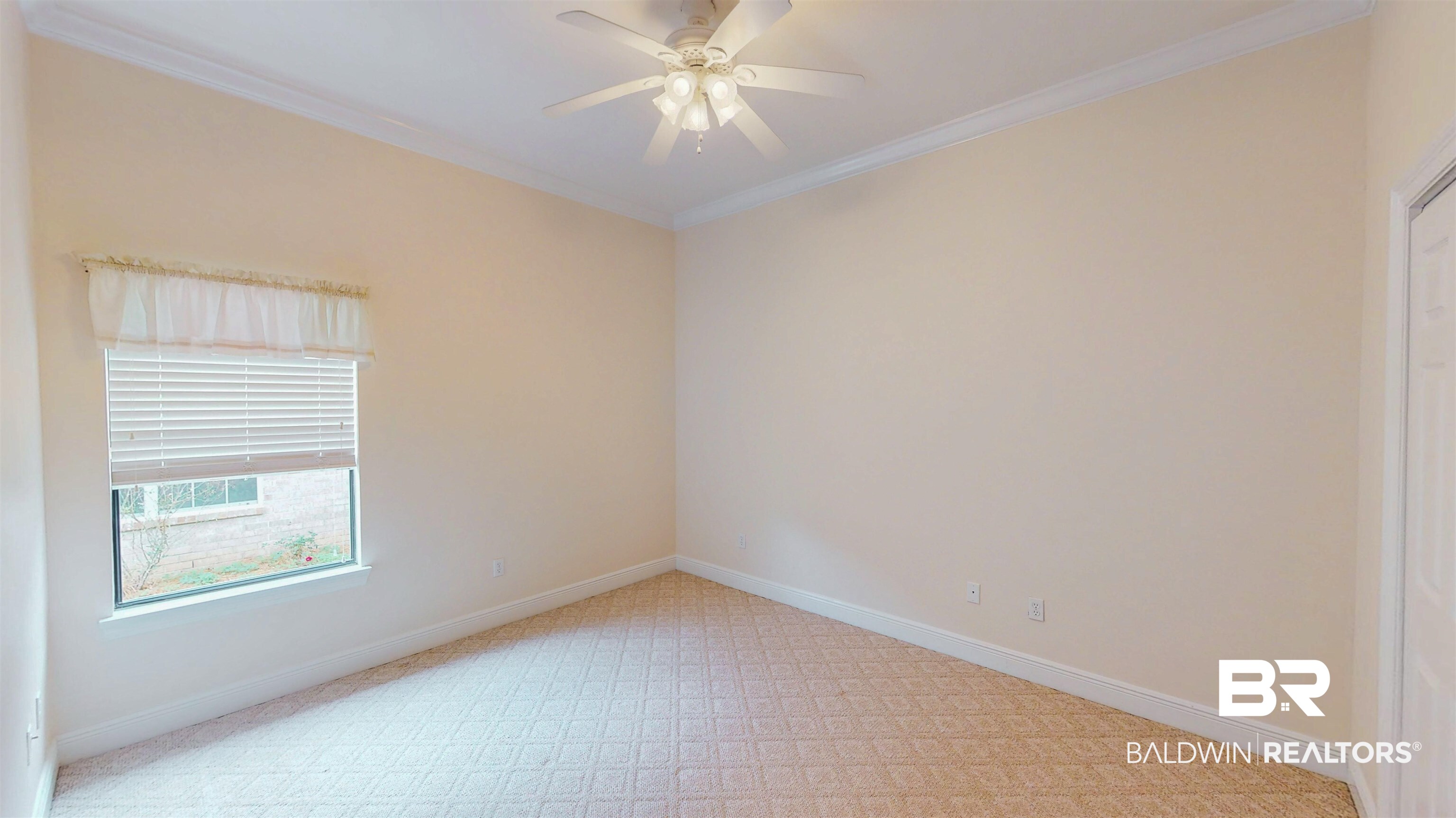 214 Hemingway Loop Foley, AL 36535 - Photo 18 of 67 Spare room with ornamental molding, ceiling fan, and light colored carpet