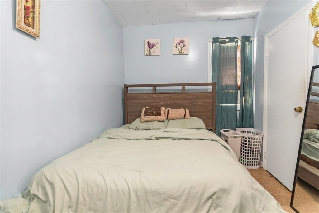 191 Farnham Street Lawrence, MA 01843 - Photo 12 of 31 a bedroom with a bed and a window