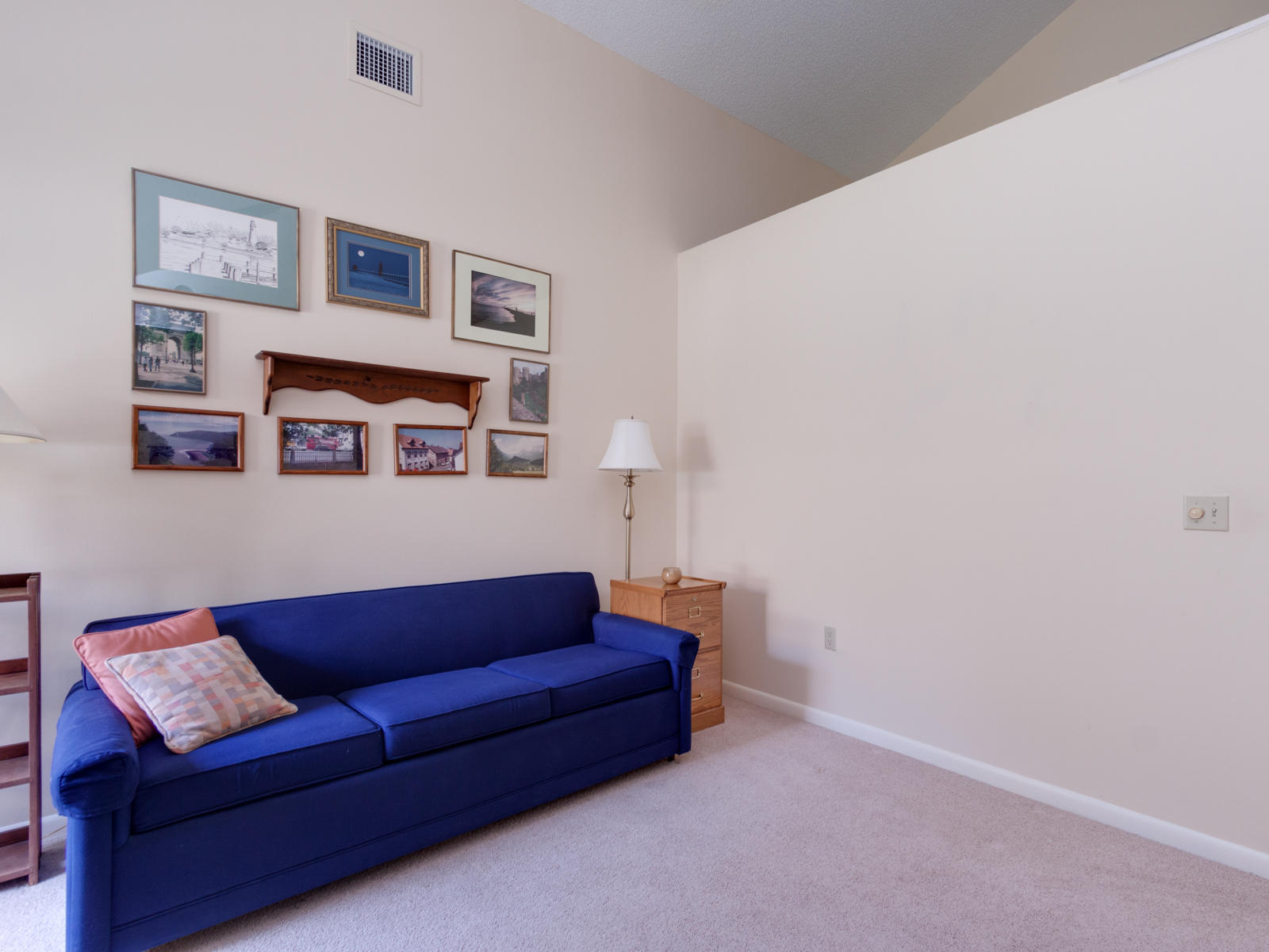 186 Ridge Road Jupiter, FL 33477 - Photo 29 of 44 a living room with furniture and a wall painting