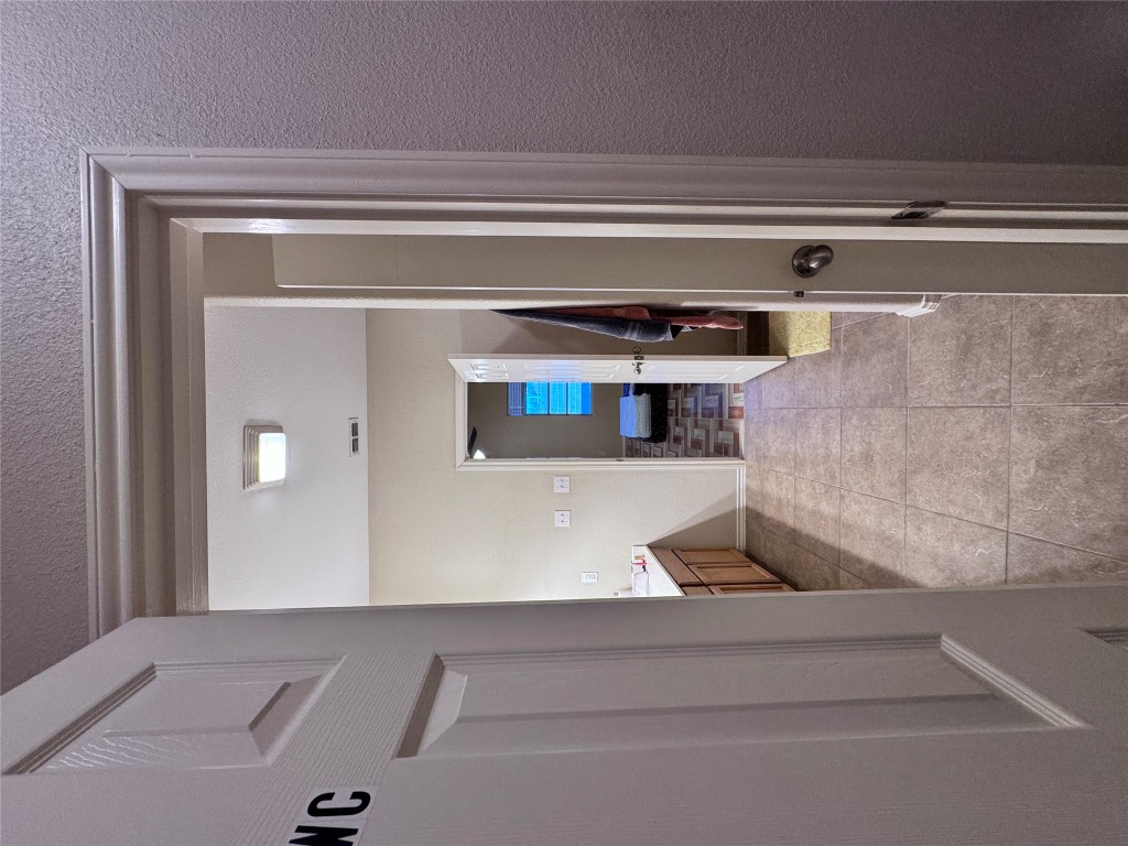 11202 Granados Street Laredo, TX 78045 - Photo 11 of 17 a view of a hallway view with wooden floor and staircase