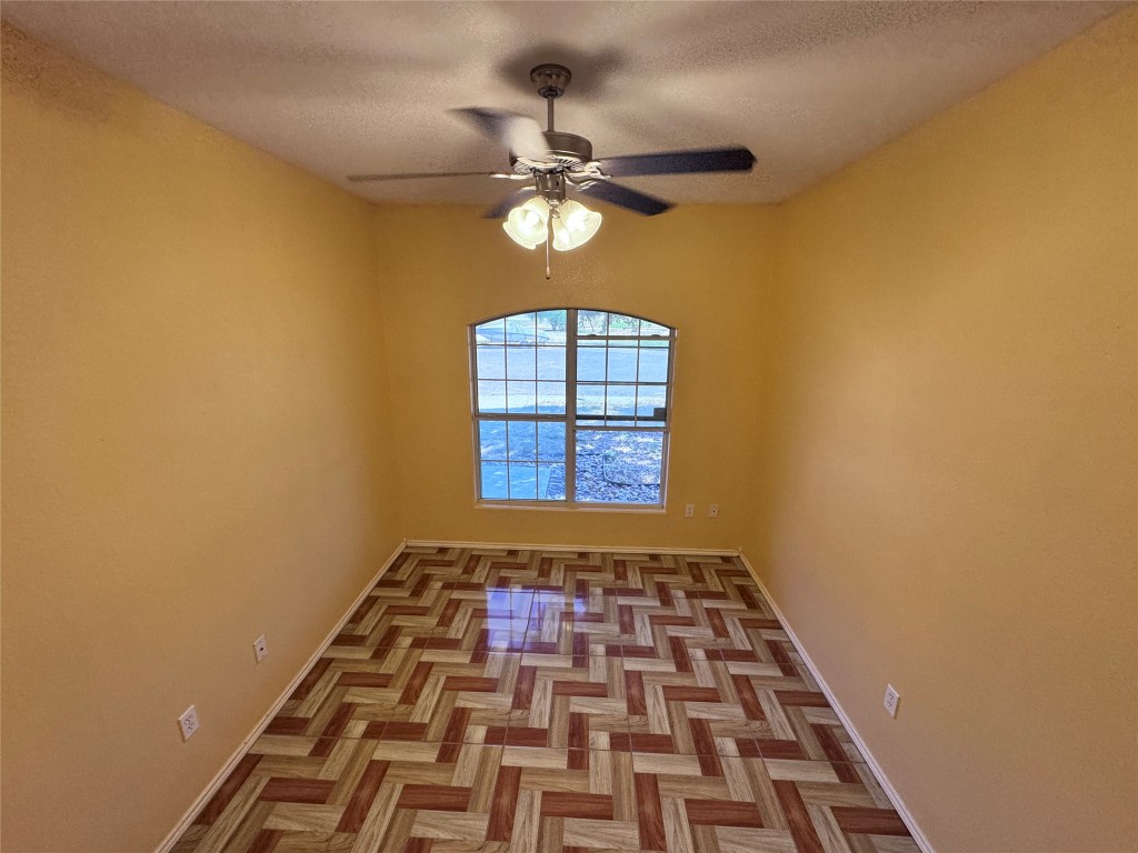 11202 Granados Street Laredo, TX 78045 - Photo 4 of 17 a view of a hallway with wooden floor and a window
