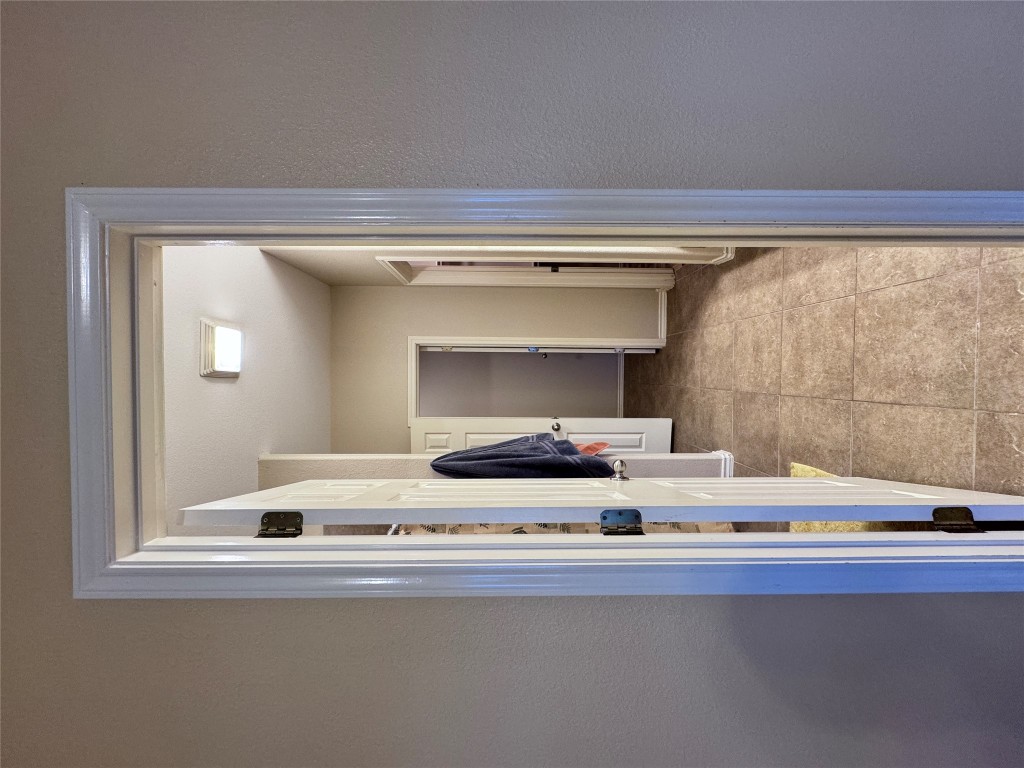 11202 Granados Street Laredo, TX 78045 - Photo 10 of 17 a view of a hallway with wooden shelves