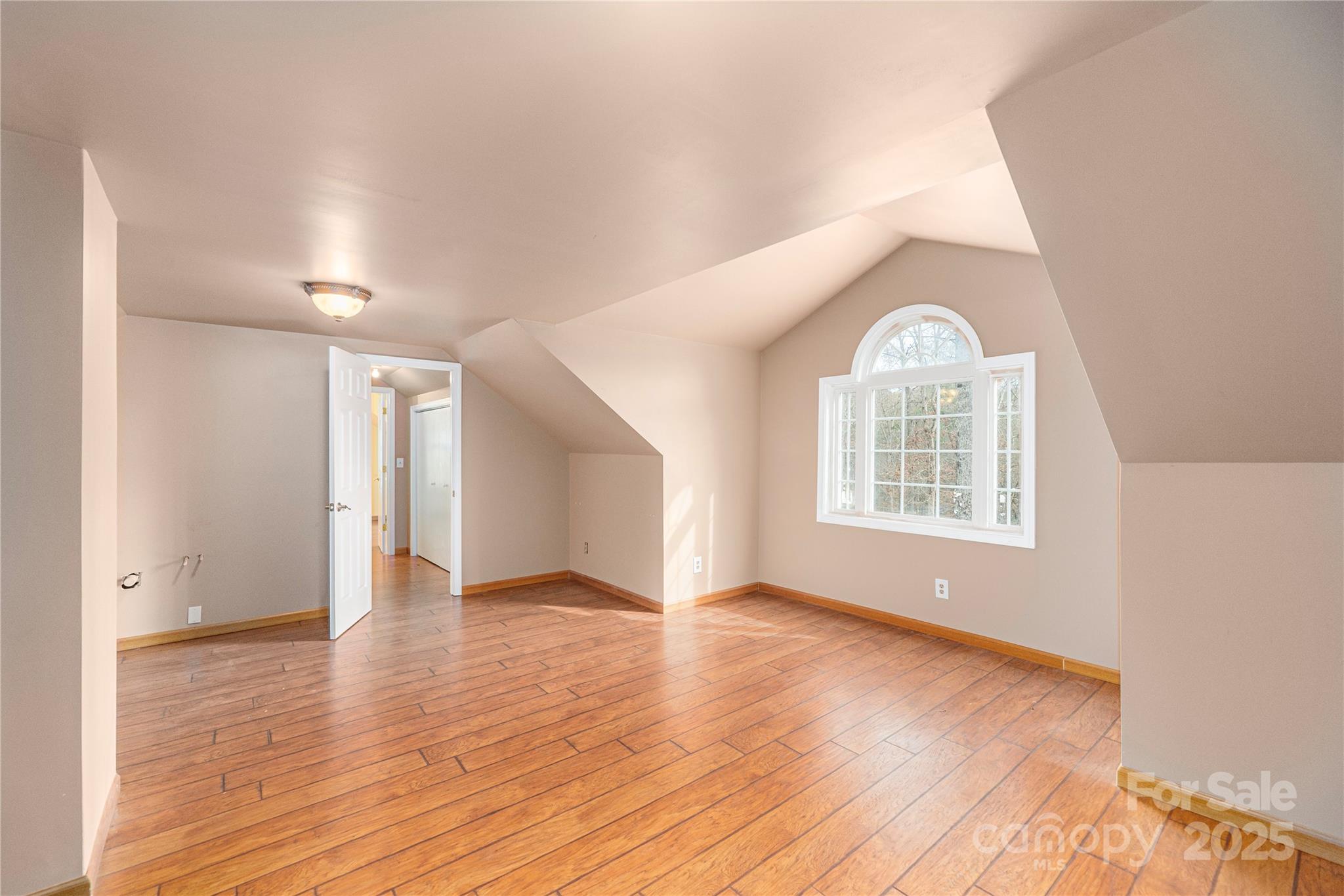 236 Pole Miller Extension Brevard, NC 28712 - Photo 18 of 38 an empty room with wooden floor and windows