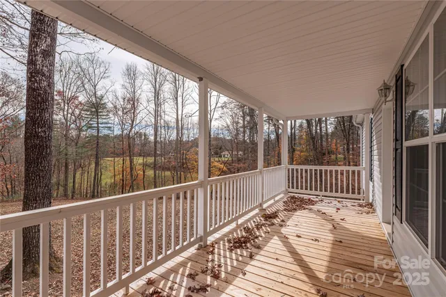 a view of balcony with wooden floor