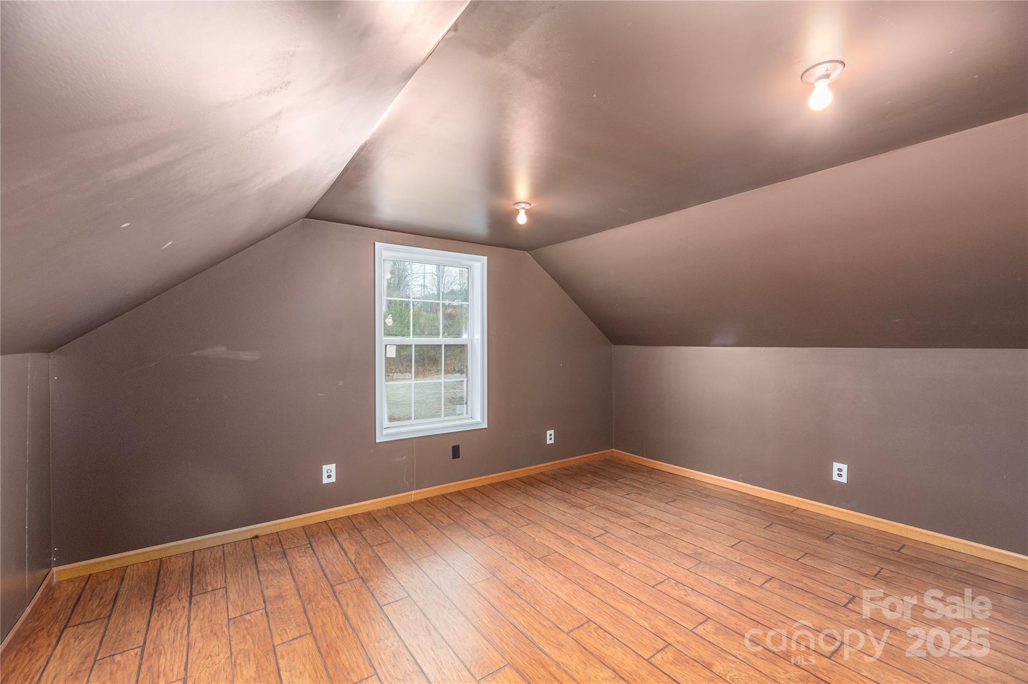 236 Pole Miller Extension Brevard, NC 28712 - Photo 21 of 38 an empty room with wooden floor and windows