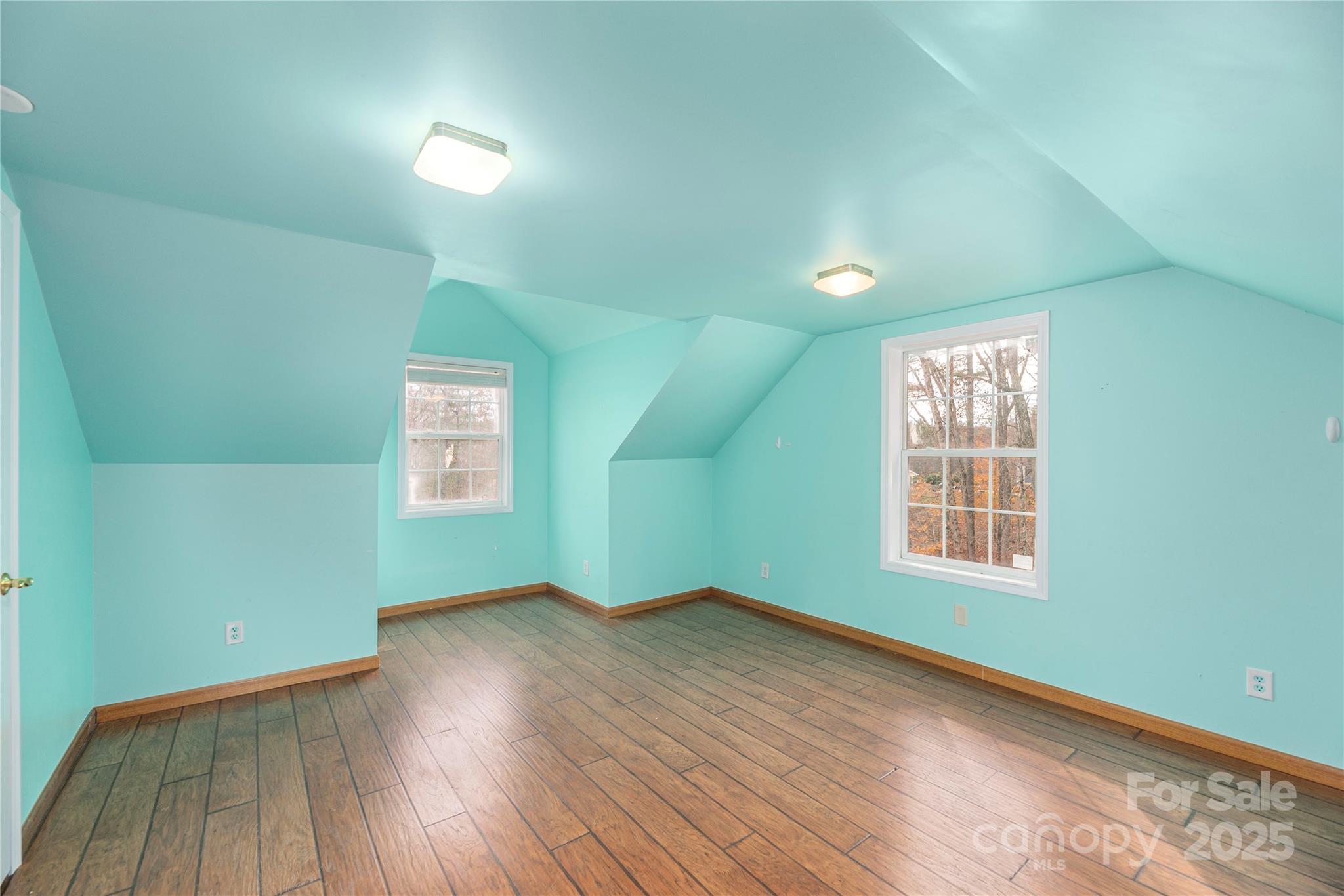 236 Pole Miller Extension Brevard, NC 28712 - Photo 22 of 38 an empty room with wooden floor and windows