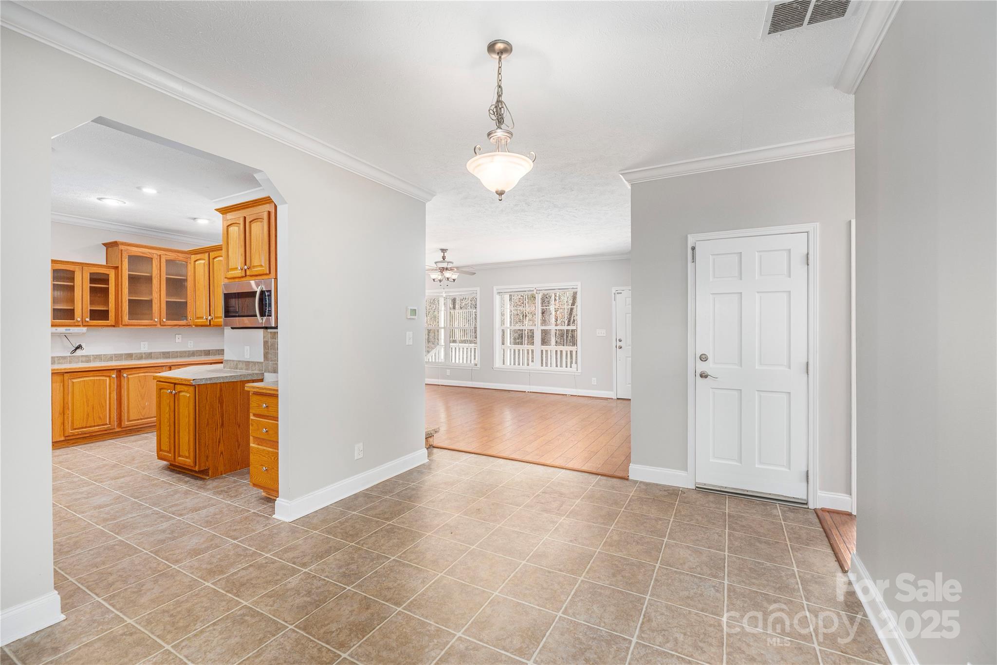 236 Pole Miller Extension Brevard, NC 28712 - Photo 7 of 38 a view of an empty room with kitchen and a window