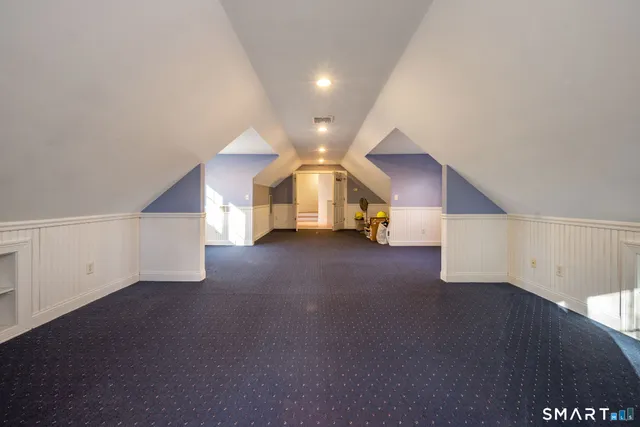 a view of a big room with closet and windows