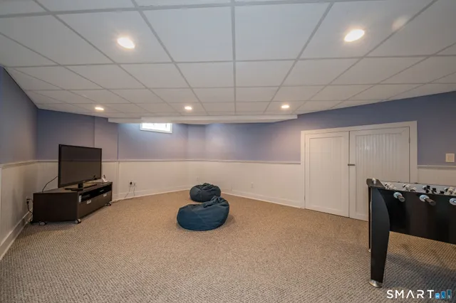 a view of a room with chairs and stairs