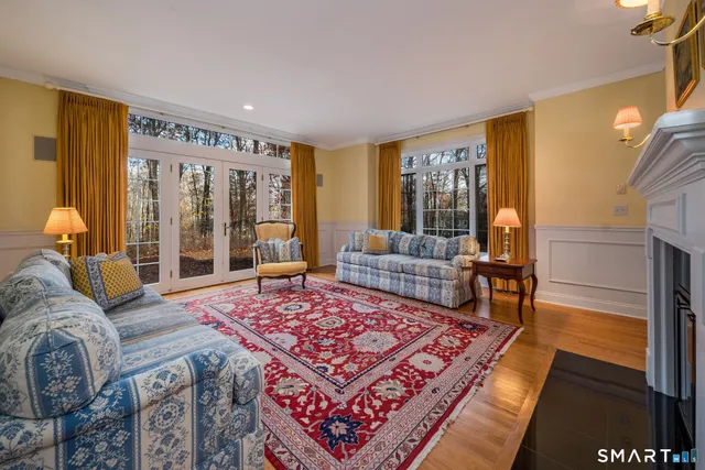 a living room with furniture rug and window