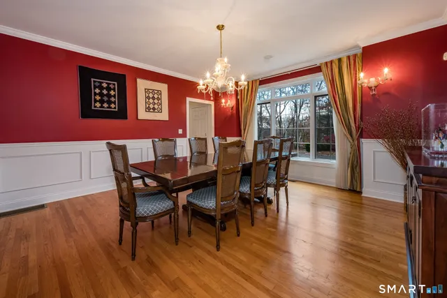 a view of a dining room with furniture and wooden floor
