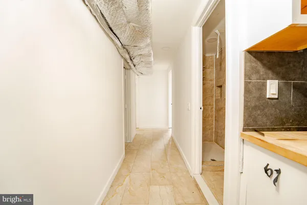 a view of a bathroom from the hallway