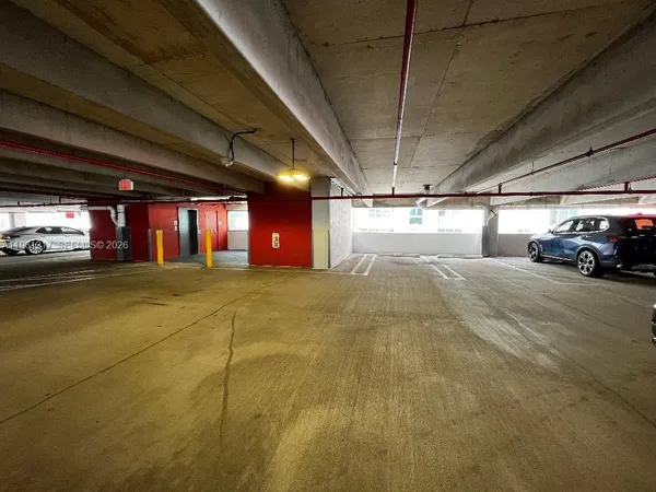 a view of parking garage with car parked