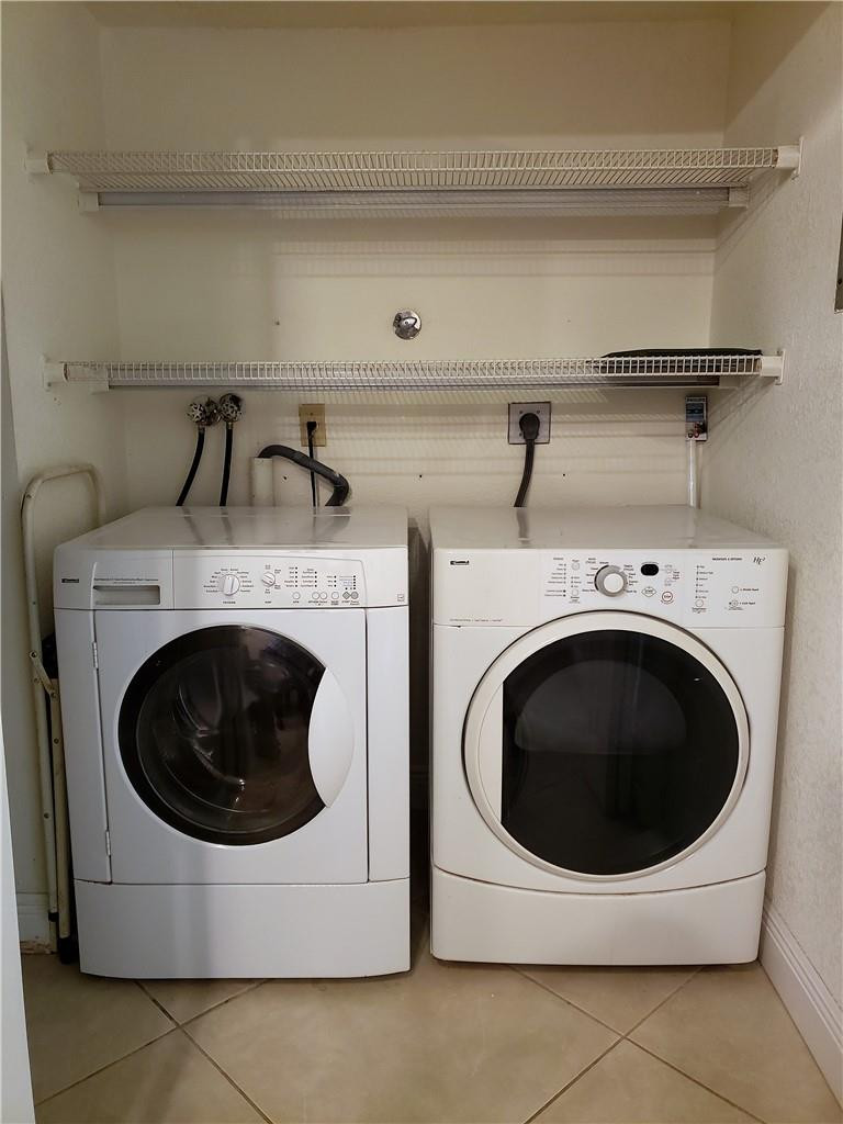 16325 Golf Club Road, Unit 112 Weston, FL 33326 - Photo 17 of 26 a utility room with dryer and washer