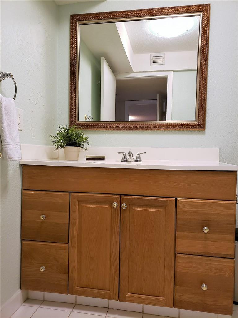 16325 Golf Club Road, Unit 112 Weston, FL 33326 - Photo 18 of 26 a bathroom with a sink and a mirror