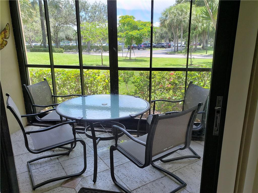 16325 Golf Club Road, Unit 112 Weston, FL 33326 - Photo 21 of 26 a view of a dining room with furniture window and outside view