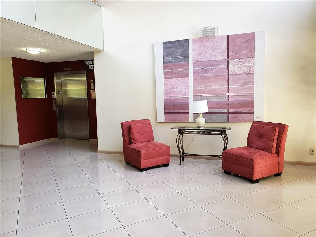 16325 Golf Club Road, Unit 112 Weston, FL 33326 - Photo 23 of 26 a room with furniture and two windows