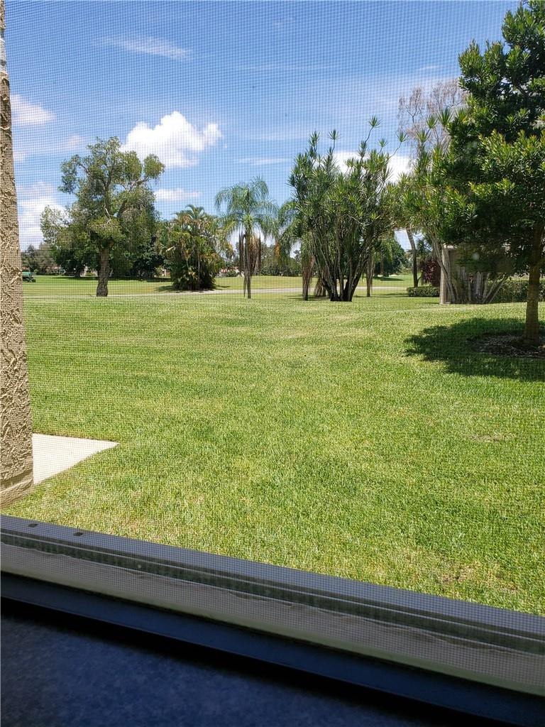 16325 Golf Club Road, Unit 112 Weston, FL 33326 - Photo 8 of 26 a view of a garden from a window