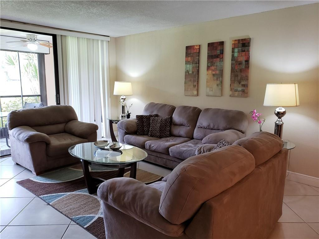 16325 Golf Club Road, Unit 112 Weston, FL 33326 - Photo 10 of 26 a living room with furniture and a window