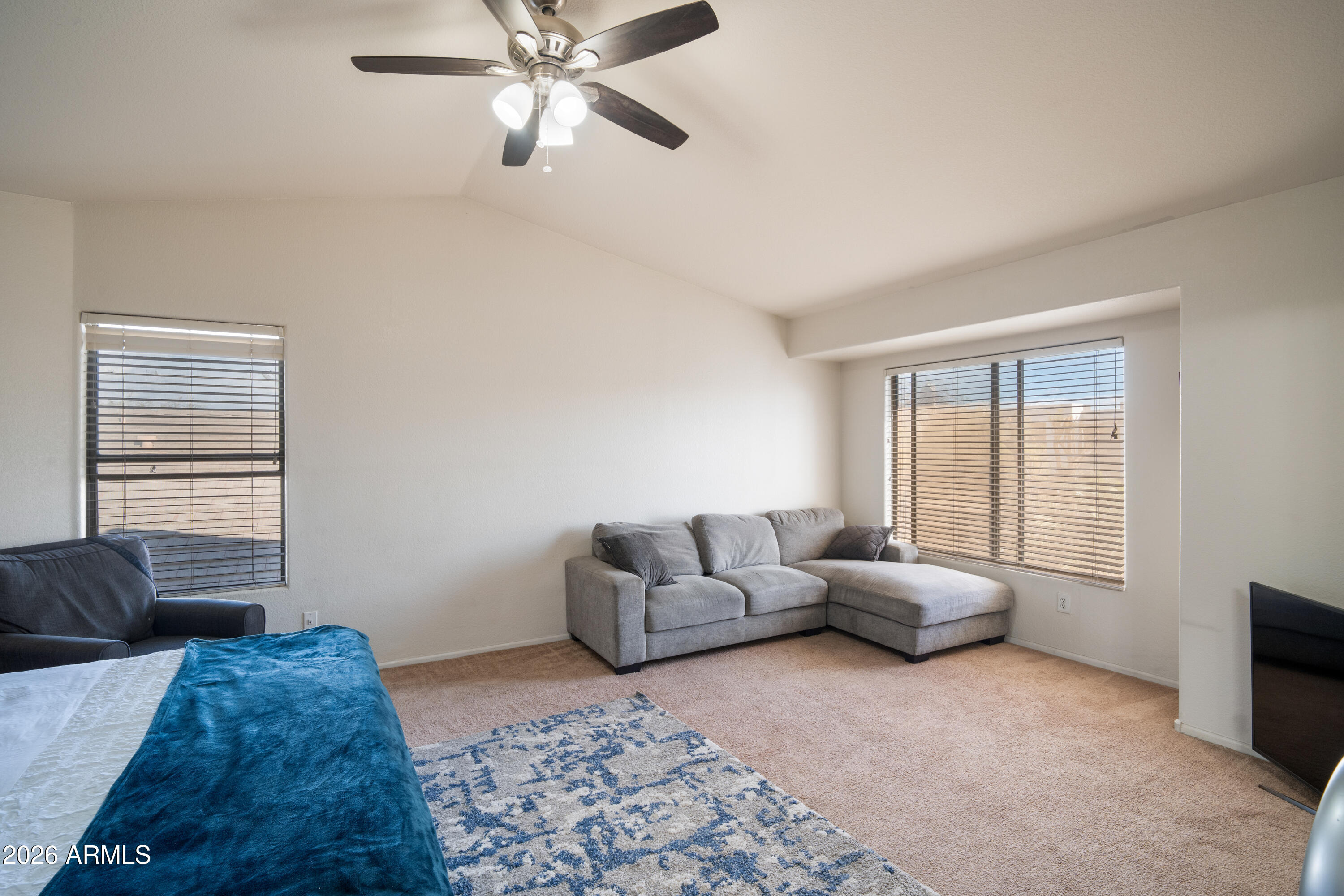 16221 West Latham Street Goodyear, AZ 85338 - Photo 13 of 30 a living room with furniture and a window